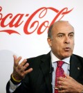 Coca-Cola CEO Muhtar Kent speaks during a news conference in Atlanta. Coca-Cola is revising its pay plan for executives after shareholders including Warren Buffett expressed disapproval and called it excessive. (AP Photo/David Goldman/0