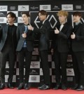 Many K-pop artists like EXO have English monikers for songs, albums and for their own names.  (AP Photo/Ahn Young-joon)