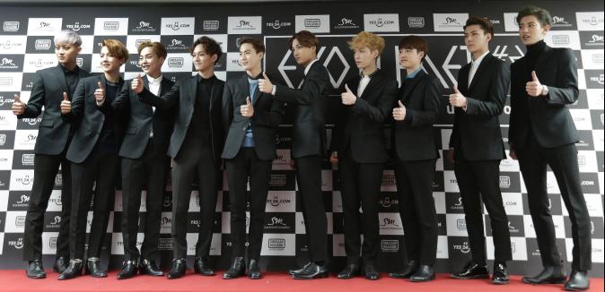 South Korean K-pop group EXO pose together for a photo during a press conference before a concert. (AP Photo/Ahn Young-joon)