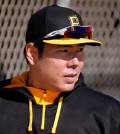 Pittsburgh Pirates' Jung Ho Kang, of South Korea, arrives for an informal spring training baseball workout in Bradenton, Fla., Thursday, Feb. 19, 2015. Pirates pitchers and catcher get underway with the first official workout of the spring this afternoon. (AP Photo/Gene J. Puskar)