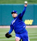 Los Angeles Dodgers starting pitcher Hyun-Jin Ryu, of South Korea, throws at a practice. (AP Photo/Charles Rex Arbogast)