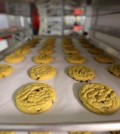 Freshly baked cannabis-infused cookies cool on a rack inside Sweet Grass Kitchen, an established Denver-based gourmet marijuana edibles bakery which sells its confections to retail outlets throughout the state. Edible marijuana sold in Colorado must look different from regular foods, state lawmakers from both parties said Wednesday, March 25, 2015, in rejecting a bill to loosen requirements. The 0-5 vote was a dramatic loss for the state’s new marijuana industry, where many producers of edible pot complain that a requirement that their products not look like other foods and drinks goes too far. (AP Photo/Brennan Linsley, File)