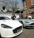 Models stand next to British supercar maker Aston Martin's Rapide S, Vanquish and DB9, at the British Embassy in Seoul, Friday. The firm plans to introduce 11 models to Korea to provide a wider choice for customers. (Yonhap)