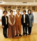 Calligrapher Lee Chul-woo, center, at the exhibition inside Chicago Cul