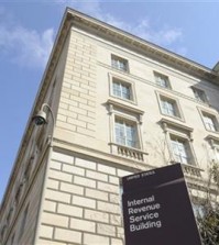 FILE - This March 22, 2013, file photo, shows exterior of the Internal Revenue Service building in Washington. Fake IRS agents have targeted more than 366,000 people with harassing phone calls demanding payments and threatening jail as part of a huge nationwide tax scam that has cost taxpayers $15.5 million. More than 3,000 people have fallen for the ruse since 2013, Timothy Camus, a Treasury deputy inspector general for tax administration, said Thursday, March 12, 2015. (AP Photo/Susan Walsh, File)