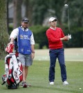 Sang-Moon Bae, right, of South Korea, prepares to hit on the ninth fairway during the first round of the RBC Heritage golf tournament in Hilton Head Island, S.C., Thursday, April 16, 2015. (AP Photo/Stephen B. Morton)