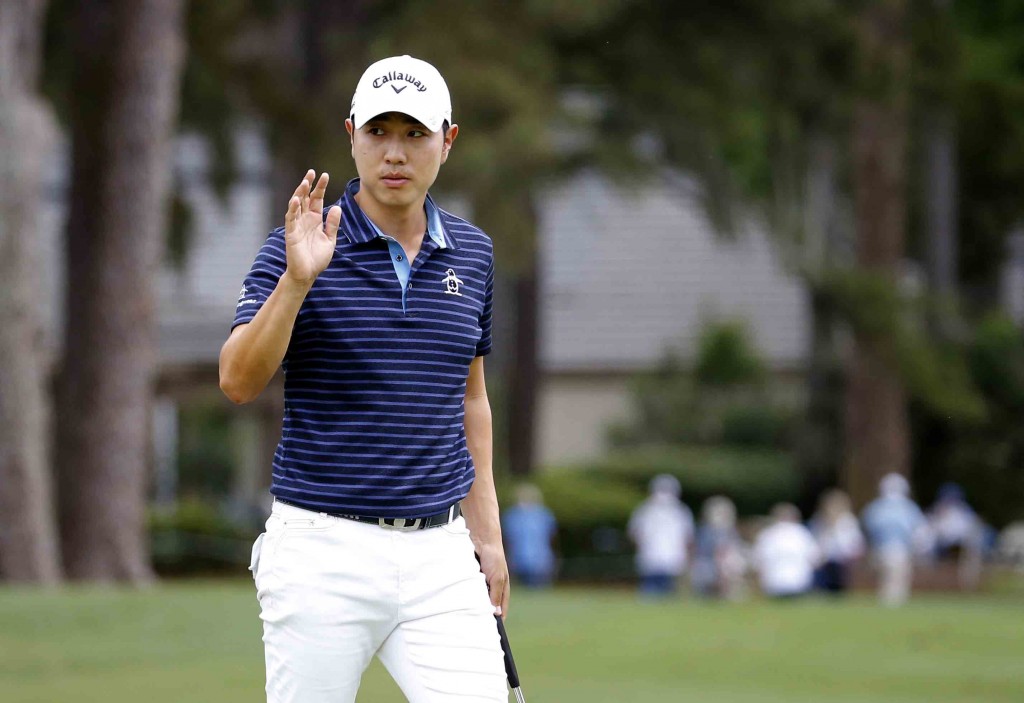 Bae Sang-moon, of South Korea, waves after making a birdie on the ninth hole during the second round of the RBC Heritage golf tournament in Hilton Head Island, S.C., Friday, April 17, 2015. (AP Photo/Stephen B. Morton)