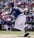 Texas Rangers' Shin-Soo Choo, of South Korea, reaches first after safely bunting down the third base line off a pitch from New York Mets' Dillon Gee in the first inning of an exhibition baseball game, Saturday April 4, 2015, in Arlington, Texas. (AP Photo/Tony Gutierrez)