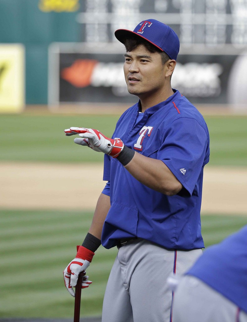 Texas Rangers left fielder Shin-Soo Choo of South Korea gestures while taking batting practice before the start of their opening day baseball game against the Oakland Athletics, Monday, April 6, 2015, in Oakland, Calif. (AP Photo/Eric Risberg)