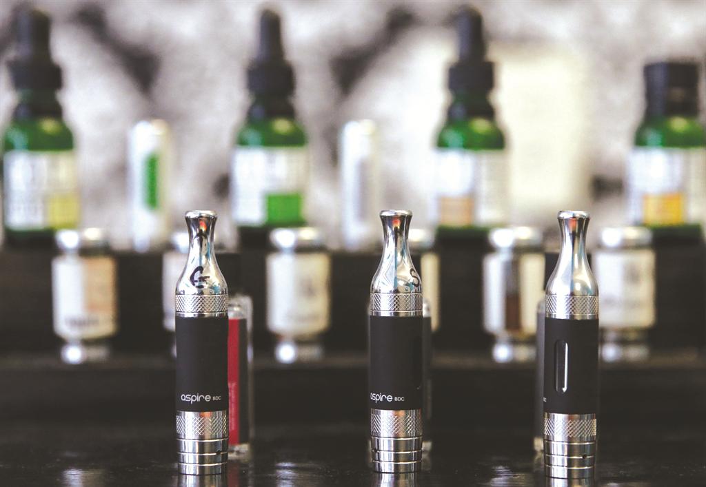 This Wednesday, April 23, 2014 photo shows electronic cigarettes and accessories displayed at a store in Chicago. For the first time, a government survey released on Thursday, April 16, 2015 says U.S. teen cigarette smoking fell below 10 percent, but dramatic increases in teens puffing electronic cigarettes and hookahs offset the use of traditional nicotine products like cigarettes, cigars, pipes, and chewing tobacco. (AP Photo/Nam Y. Huh)