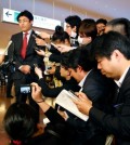 Japanese journalist Tatsuya Kato of Sankei Shimbun newspaper answers a reporter's question upon his arrival at Haneda International Airport in Tokyo Tuesday, April 14, 2015. South Korea lifted an overseas travel ban on Kato, a former Seoul bureau chief of the conservative Japanese newspaper, charged with defaming the South Korean president, officials said earlier in the day. (AP Photo/Shizuo Kambayashi)