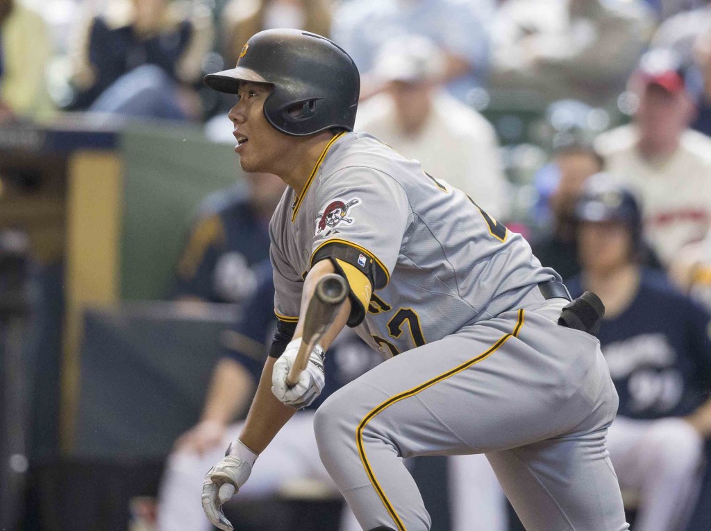 Pittsburgh Pirates' Jung Ho Kang gets his first Major League hit off of Milwaukee Brewers' Kyle Lohse during the seventh inning of a baseball game Sunday, April 12, 2015, in Milwaukee. (AP Photo/Tom Lynn)