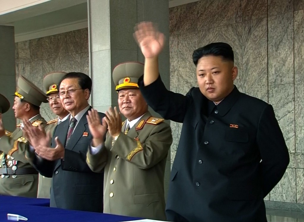 In this image taken from video North Korean leader Kim Jong Un, right, waves to spectators and participants during a military parade marking the 65th anniversary of the country's founding, Monday, Sept. 9, 2013, in Pyongyang, North Korea. (AP Photo/KRT via AP Video)