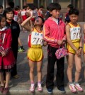 Young North Korean runners rest after finishing their part of the Mangyongdae Prize International Marathon in 2014. (David Guttenfelder/AP)