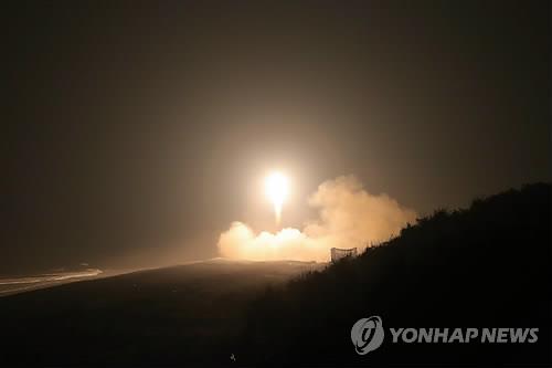 Seen here is North Korea's test-firing of a short-range missile reported by the country's Korean Central News Agency on July 27, 2014. (Yonhap file photo)