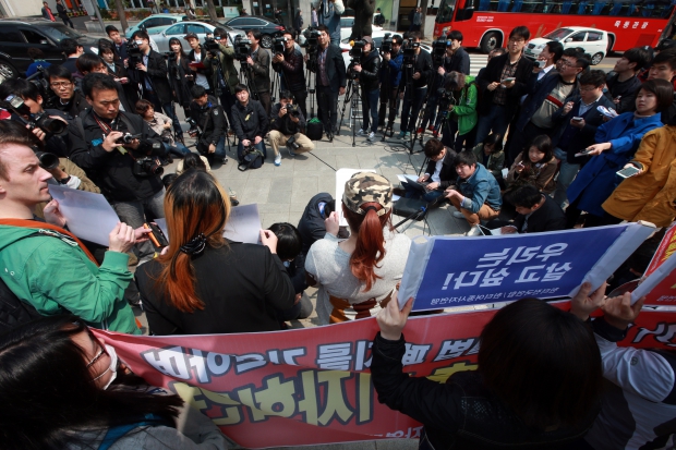 Sex workers hold a press conference in front of the Constitutional Court in Seoul on April 9, 2015 before attending the first public hearing on the constitutionality of the sex trafficking law. (Yonhap)