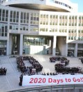 In this Jan. 12, 2015 file photo, participants form human letters "2020" during a countdown event for the 2020 Tokyo Olympics in Tokyo. Organizers of the 2020 Tokyo Olympics promised the most innovative, impeccably run and "sustainable" Games ever. With just a little over five years to go, doubts are mounting that they might not deliver on that last pledge. On Tuesday, April 7, 2015, the World Wide Fund for Nature and others that are backing use of renewable energy, including Masato Mizuno, the sports-goods magnate who led Tokyo's bid for the games, issued a formal call for faster action. (AP Photo/Koji Sasahara, File)