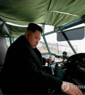 North Korean leader Kim Jong-un conducts a take-off and landing test of a newly-made light plane during a visit to a machine factory. (KCNA-Yonhap)