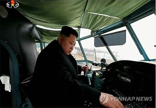 North Korean leader Kim Jong-un conducts a take-off and landing test of a newly-made light plane during a visit to a machine factory. (KCNA-Yonhap)