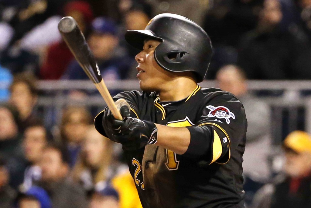 Pittsburgh Pirates' Kang Jung-ho, of South Korea, watches his three-run double off Chicago Cubs relief pitcher Jason Motte in the seventh inning of a baseball game in Pittsburgh, Tuesday, April 21, 2015. (AP Photo/Gene J. Puskar)