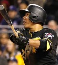 Pittsburgh Pirates' Kang Jung-ho, of South Korea, watches his three-run double off Chicago Cubs relief pitcher Jason Motte in the seventh inning of a baseball game in Pittsburgh, Tuesday, April 21, 2015. (AP Photo/Gene J. Puskar)