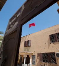 A flag flies over the Moroccan Embassy after a bomb placed in a garbage bin targeted the site in the capital, Tripoli. in Tripoli, Libya on Monday, April 13, 2015. There were no casualties in the attack, which was claimed by Libya's Islamic State affiliate. (AP Photo/Mohamed Ben Khalifa)