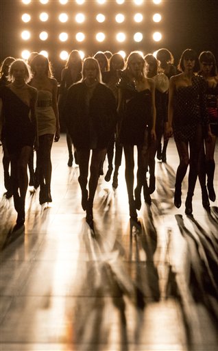 FILE- In this March 9, 2015 file photo, models wear creations for Saint Laurent's Fall/Winter 2015-2016 Ready to Wear fashion collection presented in Paris, as part of Paris Fashion Week. France뭩 lower house of Parliament has approved Friday April 3, 2015 a measure that would make it a crime to use anorexic models in advertising. (AP Photo/Jacques Brinon, File)