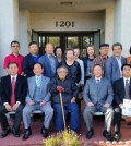 Monterey's Korean American community leaders pose in front of a newly acquired building that will serve as a hub of the Korean community.
