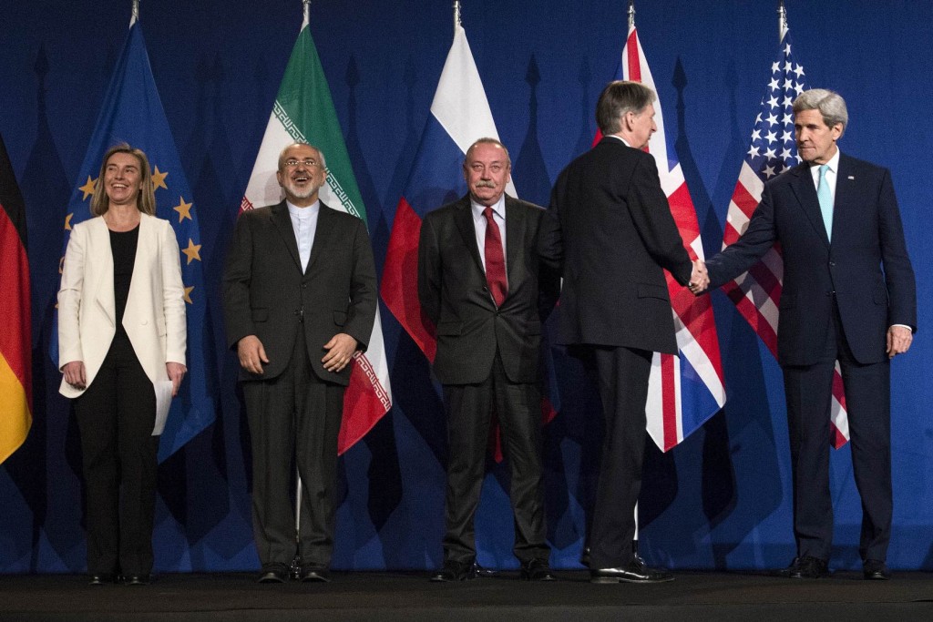 Top level officials from around the world shake hands Lausanne, Switzerland, Thursday, April 2, 2015, after Iran nuclear program talks finished with extended sessions. (AP Photo/Brendan Smialowski, Pool)