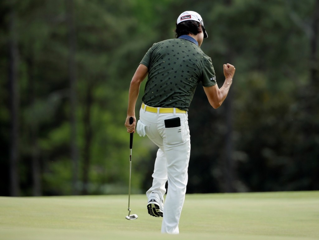 Kevin Na reacts to a birdie putt on the 18th hole during the second round of the Masters golf tournament Friday, April 10, 2015, in Augusta, Ga. (AP Photo/Matt Slocum)