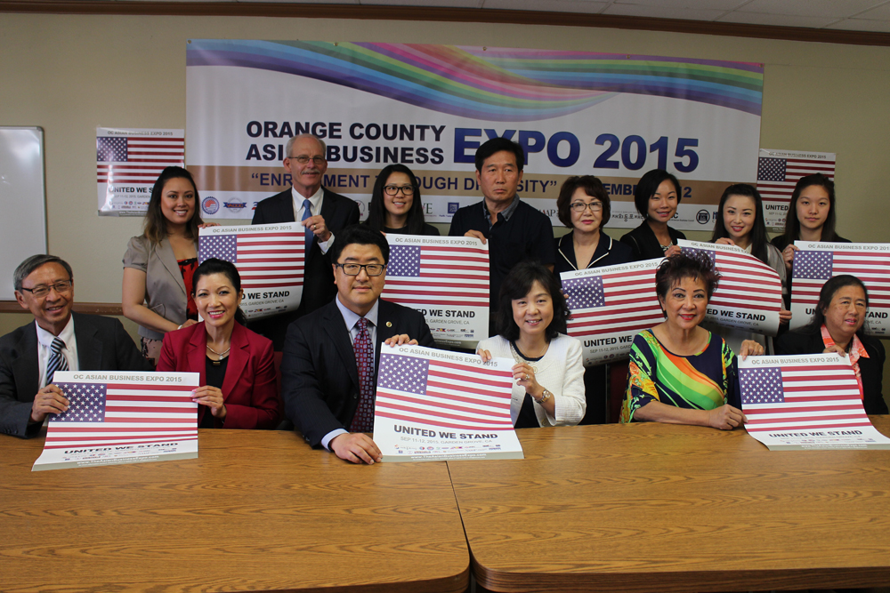 Community organization representatives pose for a photo during a press conference announcing the Orange County Asian Business Expo 2015.