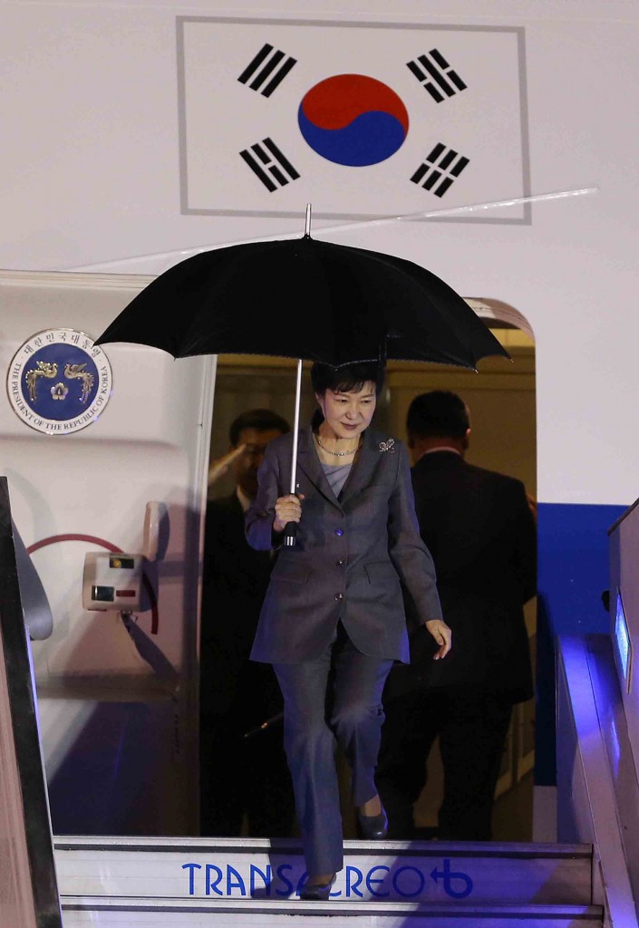 South Korean President Park Geun-hye descends from the plane upon her arrival to the military airport in Bogota, Colombia, Thursday, April 16, 2015. Park Geun-hye is in Colombia in an official two-days visit and will then tour Peru, Chile and Brazil. (AP Photo/Fernando Vergara)