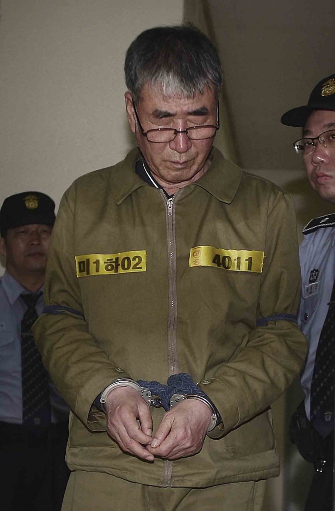 Lee Joon-seok, the captain of the sunken South Korean ferry Sewol, arrives for verdicts at Gwangju High Court in Gwangju, South Korea, Tuesday, April 28, 2015. The South Korean appellate court on Tuesday handed down a sentence of life in prison to Lee. The sentencing is harsher than a November verdict by a district court that sentenced Lee to 36 years in prison for negligence and abandoning passengers in need. (Park Chul-hong/Yonhap via AP)