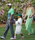 Tiger Woods walks with his children Sam and Charlie and Lindsey Vonn during the Par 3 contest at the Masters golf tournament Wednesday, April 8, 2015, in Augusta, Ga. (AP Photo/David J. Phillip)