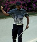 Tiger Woods reacts after a birdie on the 13th hole during the third round of the Masters golf tournament Saturday, April 11, 2015, in Augusta, Ga. (AP Photo/Chris Carlson)