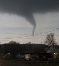 A funnel cloud crosses south Perryville Road on Thursday, April 9, 2015, south of Interstate 39 in Rockford, Ill. (AP Photo/Rockford Register Star, Max Gersh)
