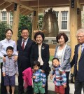 Lee Yong and his family attend the unveiling ceremony of the peace bell at Lehman College Wednesday. (Photo courtesy of X-Treme Home Health Nurse Aide)