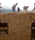 A Nepalese family works to rebuild their damaged house in Lalitpur, Nepal, Friday, May 8, 2015. The April 25 earthquake killed thousands and injured many more as it flattened mountain villages and destroyed buildings and archaeological sites in Kathmandu. (AP Photo/Niranjan Shrestha)