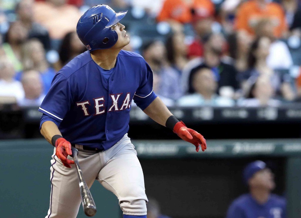 Texas Rangers' Shin-Soo Choo watches the ball go over the wall for a two-run homer against the Houston Astros in the second inning of a baseball game Wednesday, May 6, 2015, in Houston. (AP Photo/Pat Sullivan)
