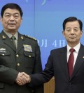 Chinese Defense Minister Chang Wanquan, left, poses with his South Korean counterpart Han Min-goo for photographers prior to a meeting at the Defense Ministry in Seoul. (AP Photo/Ed Jones, Pool)