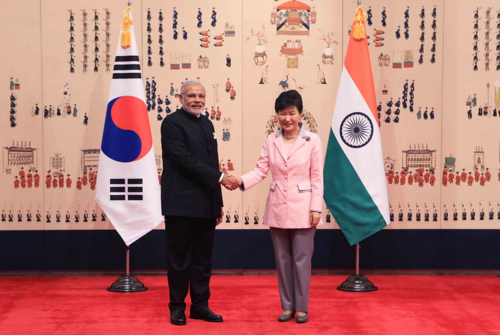 Indian Prime Minister Narendra Modi, left,  shakes hands with South Korean President Park Geun-hye prior to their meeting at the presidential Blue House Monday, May 18, 2015 in Seoul, South Korea. (Chung Sung-Jun/Pool Photo via AP)