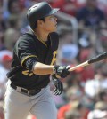 Pittsburgh Pirates' Kang Jung-ho, of South Korea, watches his solo home run against the St. Louis Cardinals in the ninth inning in a baseball game, Sunday, May 3, 2015, at Busch Stadium in St. Louis. (AP Photo/Bill Boyce)