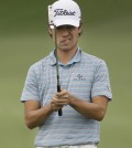 Kevin Na lines up a putt on the 18th hole during the third round of the Colonial golf tournament, Saturday, May 23, 2015, in Fort Worth, Texas. Na is in leading the tournament at 11 under. (AP Photo/LM Otero)