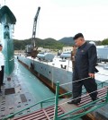 This undated picture released from North Korea's official Korean Central News Agency (KCNA) on June 16, 2014 shows North Korean leader Kim Jong-Un (R) inspecting the submarine No. 748 of Korean People's Army (KPA) naval unit 167 led 7th regiment at an undisclosed location in North Korea (KCNA/Yonhap)