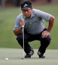 K.J. Choi lines up a putt on the first hole during the first round of the Wells Fargo Championship golf tournament at Quail Hollow Club in Charlotte, N.C., Thursday, May 14, 2015. (AP Photo/Chuck Burton)