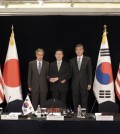 South Korea's Special Representative for Korean Peninsula Peace and Security Affairs Hwang Joon-kook, center, U.S. State Department’s Special Representative for North Korea Policy Sung Kim, right, and Japanese Foreign Ministry’s Director-General for Asian and Oceanian Affairs Junichi Ihara pose for the media before their meeting about North Korea in Seoul, South Korea, Wednesday, May 27, 2015. (AP Photo/Lee Jin-man)