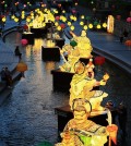 People enjoy looking at colorful lotus lanterns lit along the Cheonggye Stream in Seoul on May 13, 2015, ahead of Buddha's Birthday, which falls on May 25. (Yonhap)