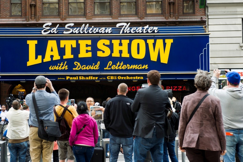 Fans wait outside The Ed Sullivan Theater during the last taping of the "Late Show with David Letterman" on Wednesday, May 20, 2015, in New York. (Photo by Charles Sykes/Invision/AP)
