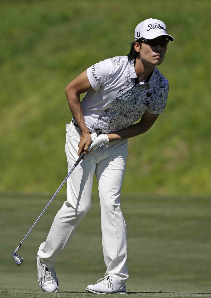 Kevin Na follows his shot from the seventh fairway, during the second round of The Players Championship golf tournament Friday, May 8, 2015, in Ponte Vedra Beach, Fla. (AP Photo/Chris O'Meara)