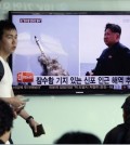 South Korean men pass by a TV news program showing images published in North Korea's Rodong Sinmun newspaper of North Korea's ballistic missile believed to have been launched from underwater and North Korean leader Kim Jong-un, at Seoul Railway station in Seoul, South Korea, Saturday, May 9, 2015. North Korea said Saturday it has successfully test-fired a newly developed ballistic missile from a submarine in what would be the latest display of the country's advancing military capability. The letters on the screen read "The missile believed to have been launched from underwater near Sinpo". (AP Photo/Ahn Young-oon)